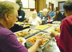 Community members of Lambertville, NJ enjoy Community Kitchen- a great way to foster the community-mindedness McKibben percribes. 